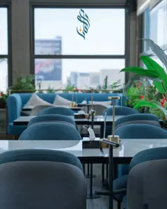 Lounge seating by the windows at Bilkana Rooftop